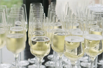 Lots of champagne glasses outdoors
