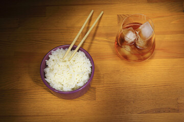 Rice in a cup, healthy food, Asian cuisine, glass of whiskey with ice.