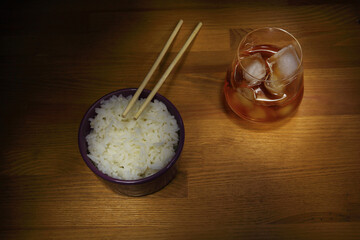Rice in a cup, healthy food, Asian cuisine, glass of whiskey with ice.