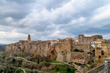 Fototapeta na wymiar Panoramic view of the ancient village of Pitigliano, Grosseto, Italy, built on tuff rock