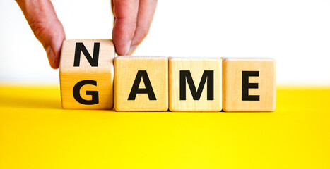 Name of the game symbol. Wooden blocks with concept words Name Game. Businessman hand. Beautiful...