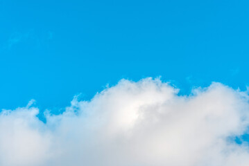 Nice cloudscape white fluffy clouds in the blue sky.Blue sky background with clouds