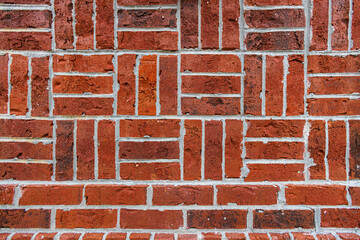 Wall of laid in alternate squares of vertical and horizontal bricks