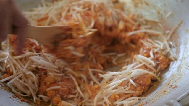 POV While Cooking Fry Pad Thai In Kitchen. Famous Street Food Of Thailand