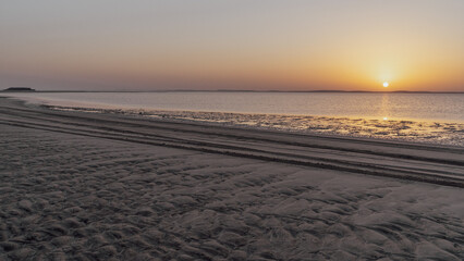 Sunset in Sealine with beautiful sand pattern emerged due to low tide.