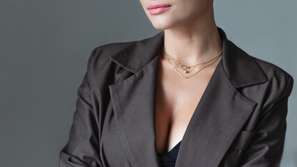 Female chin, close-up of lips and chin. Business girl in a jacket