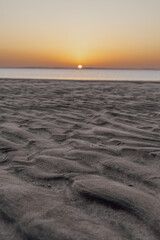 Sunset in Sealine with beautiful sand pattern emerged due to low tide.