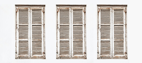 Wooden window shutter. Rustic frame window white paint wall. Closed window isolated. European style...