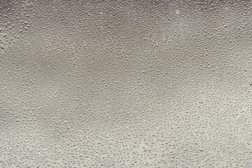 Water drops on glass. Water on a glass surface. Precipitation texture