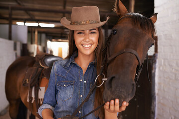 A girls best friend. Shot of a young woman tending to her horse.