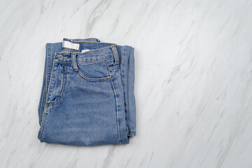 Top view, Blue jeans on white background.