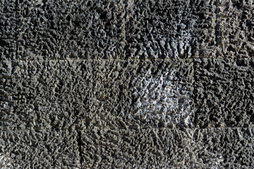 wall with unevenly polished granite stones