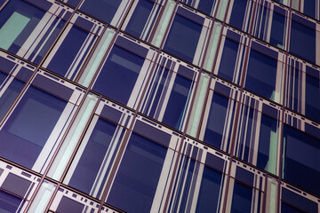 Glass and metal building, office and business center in a large city. Image toned.