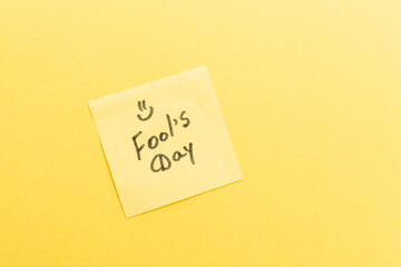 Sticker with text fools day on the yellow background. Copy space for text