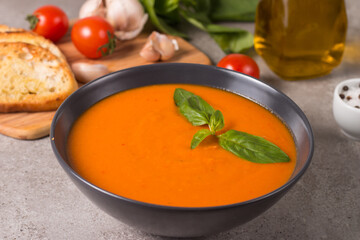 Tomato soup with basil.  Healthy, vegan and dieting lunch and dinner concept. Gazpacho. 