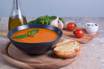 Tomato soup with basil.  Healthy, vegan and dieting lunch and dinner concept. Gazpacho. 