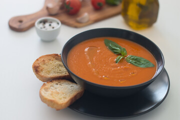 Tomato soup with basil.  Healthy, vegan and dieting lunch and dinner concept. Gazpacho. 