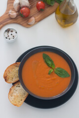 Tomato soup with basil.  Healthy, vegan and dieting lunch and dinner concept. Gazpacho. 