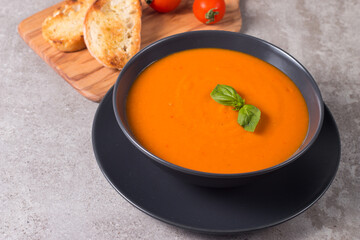 Tomato soup with basil.  Healthy, vegan and dieting lunch and dinner concept. Gazpacho. 