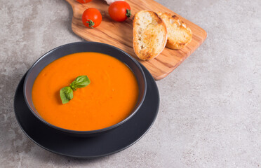 Tomato soup with basil.  Healthy, vegan and dieting lunch and dinner concept. Gazpacho. 
