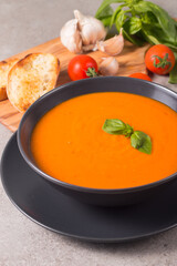 Tomato soup with basil.  Healthy, vegan and dieting lunch and dinner concept. Gazpacho. 