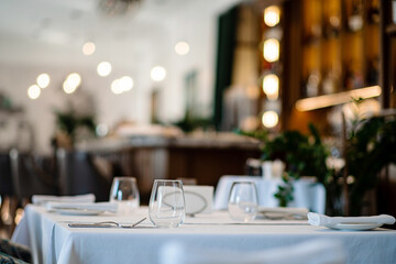 glasses on empty restaurant table in contemporary restaurant