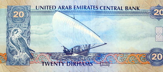 Large fragment of obverse side of 20 AED twenty Dirhams banknote of United Arab Emirates that...