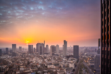 Fototapeta na wymiar Skyline Frankfurt from above during an atmospheric, colorful sunrise. Cityscape in Germany with skyscrapers. city, Sunset