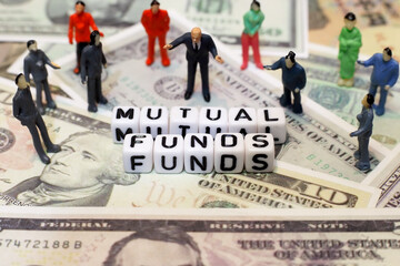 crowd of people and letter cube on dollar background. conceptual image for mutual fund, investment and financial.