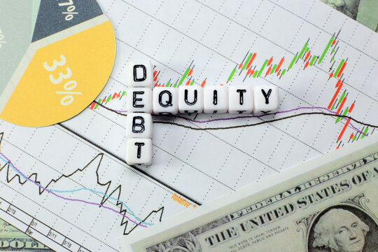 Debt and equity letter cube on white candle stick chart background. conceptual image for D/E ratio in stock investment.