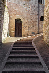 Fototapeta na wymiar Ancient street in Assisi historic center, Umbria Italy