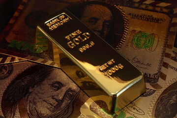 A Golden bar with dollar background. conceptual image or gold investment.