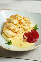 Crepes filled with cottage cheese and raspberry