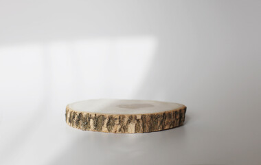 Wooden eco rustic pine tree wood circle disc platform podium on white background. Minimal empty...