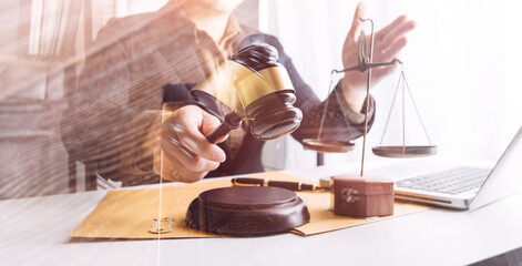 Judge gavel with Justice lawyers having team meeting at law firm in background. Concepts of law.