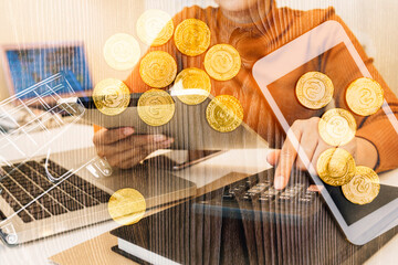 Empty shopping cart and money stacks in growth graph on background of colored bokeh christmas lights