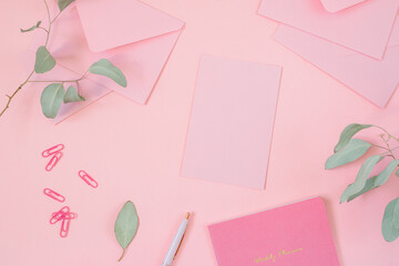 Blank branding paper card with mockup copy space on pastel pink background.