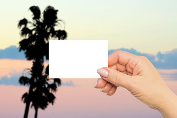 Hot summer horizontal business card mock up. Woman hand on Malibu landscape