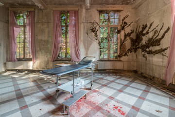 Lost Place Sanatorium. blood on the floor. Ivy grows to the window
