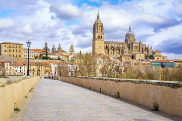 Causeway of the Roman bridge over the river that leads to the monumental city of Salamanca, Spain.