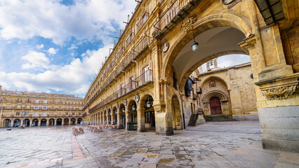 Entrance arch to the Plaza Mayor of Salamanca with its medieval architecture. - obrazy, fototapety, plakaty