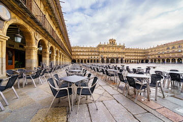 Plaza Mayor de Salamanca with tables and chairs to sit outdoors and enjoy its surroundings and...