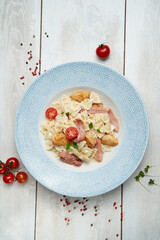 Tagliatelle spaghetti with chicken and pork