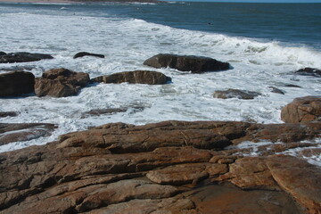 Waves breaking on rocks