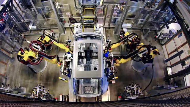 Robotic equipment modern factory floor. Industrial factory indoors and machinery.