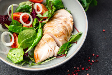 salad chicken breast vegetable tomato, onion, green mix leaves lettuce fresh meal food snack on the table copy space food background 