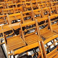 Wooden folding chairs that can be rented for Holy Week processions in Seville, Spain