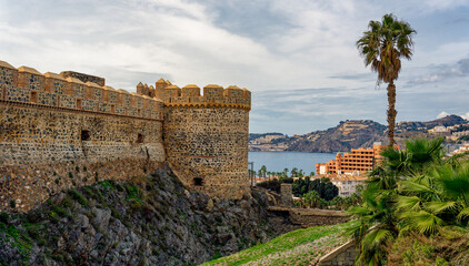 Partial view of historic Saint Michael castle on the Mediterranean beach of Almuñecar, Granada,...