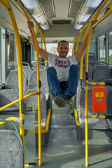 Fototapeta na wymiar happy man in the city bus call and others