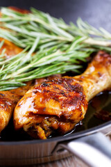 Fried Chicken Drumsticks with Herbs in a Pan